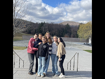 Six students outside at the Clark Art Museum